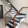 Cầu thang kính trụ lửng inox 304